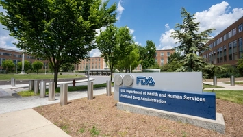 U.S. Food and Drug Administration outdoor sign with FDA logo and campus buildings