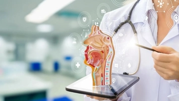 Doctor holding a tablet with a 3D throat cross-section and digital medical icons